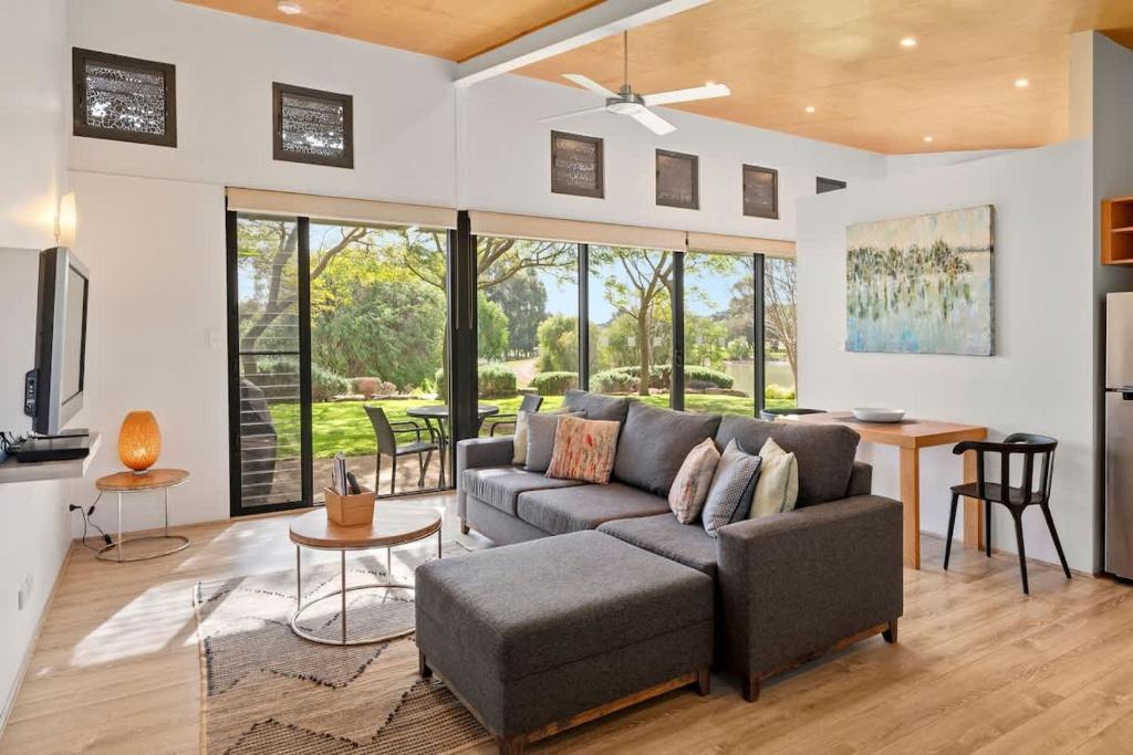 a living room with a couch and a table at Petra Olive 5 in Yallingup