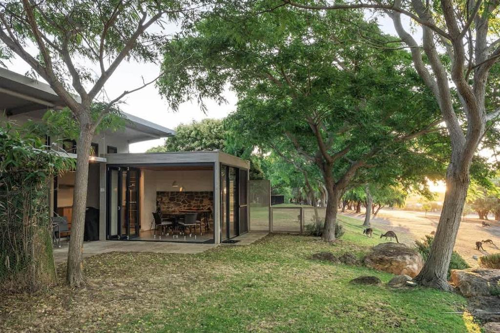 a house with a glass extension with trees at Petra Olive 4 in Yallingup