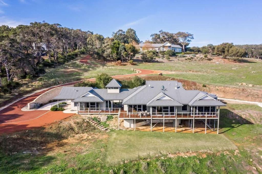 an aerial view of a house on a hill at Valley Views - Elevated Hilltop Escape near Beaches in Yallingup