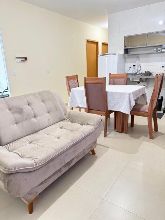a living room with a couch and a table at Casa 20 in Araguaína
