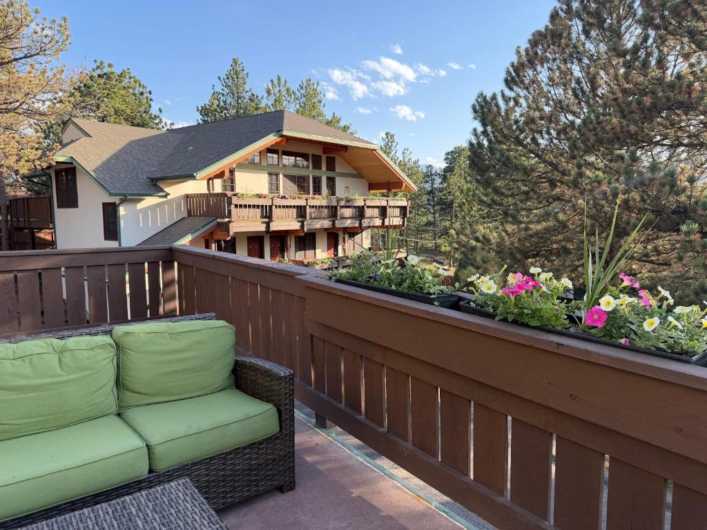 a wicker chair sitting on the balcony of a house at Appenzell Inn in Estes Park