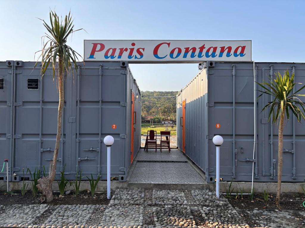 a gate with a sign that reads paris container at Contana Paris in Girijati
