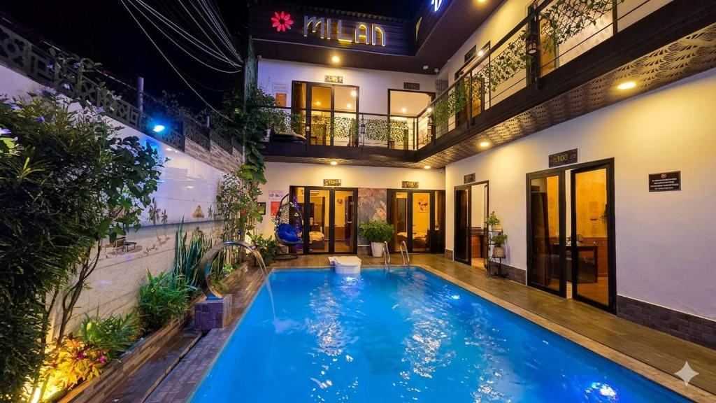 a swimming pool in the middle of a building at Mi Lan Boutique Resort in Vung Tau