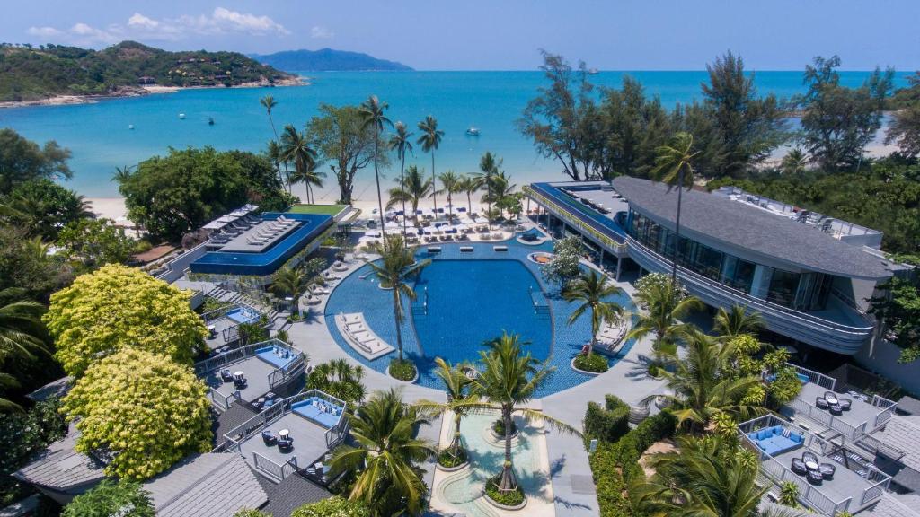 an aerial view of a resort with a pool and the beach at Meliá Koh Samui in Choeng Mon Beach