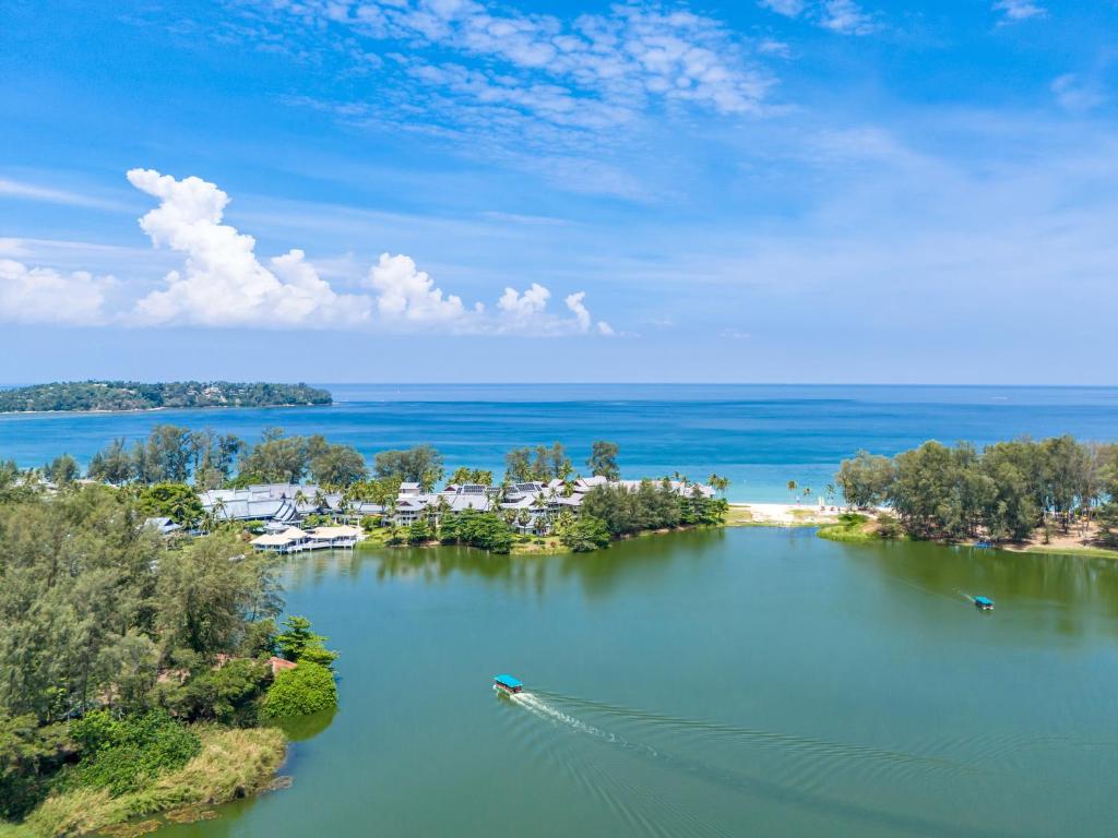 an aerial view of a lake with a boat in it at Cassia Apartment 1 in Bang Tao Beach