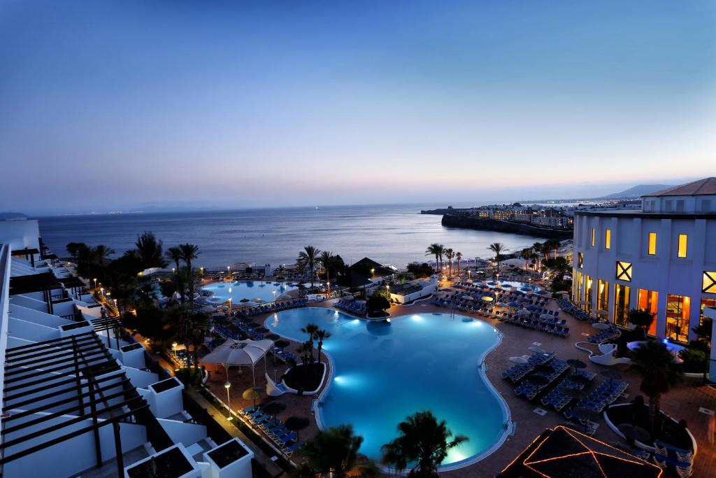 an aerial view of a resort with a swimming pool at Sandos Papagayo in Playa Blanca