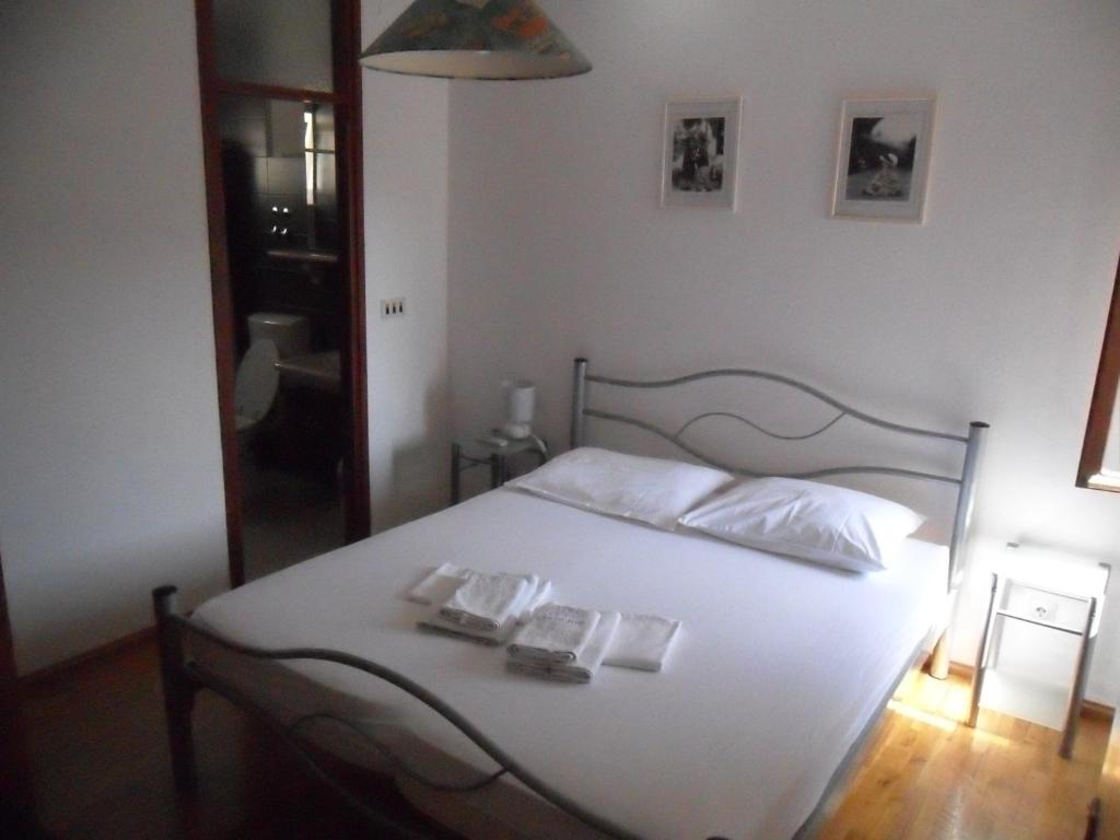 Postel nebo postele na pokoji v ubytování SD House Rooms