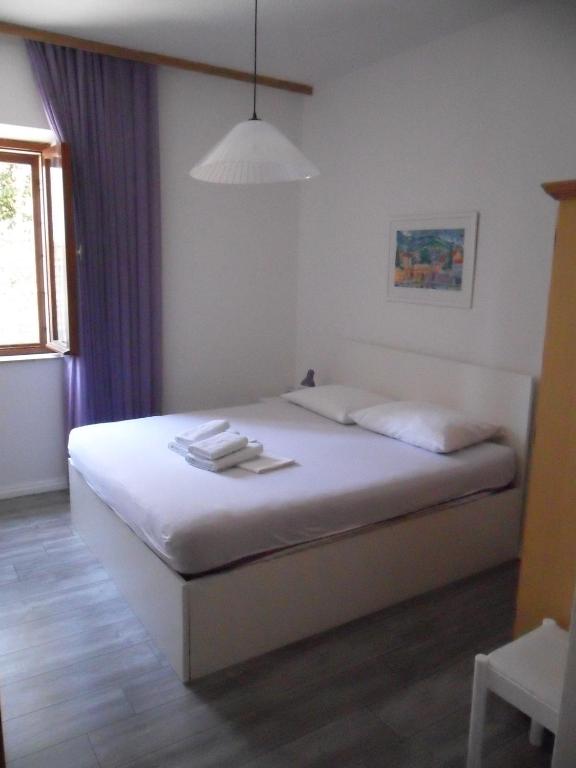Postel nebo postele na pokoji v ubytování SD House Rooms