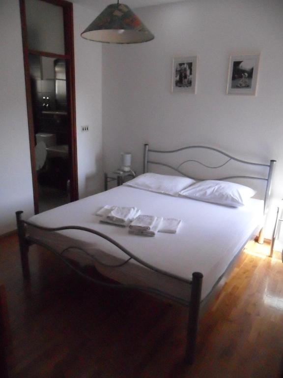 Postel nebo postele na pokoji v ubytování SD House Rooms
