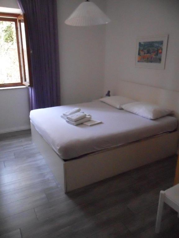 Postel nebo postele na pokoji v ubytování SD House Rooms
