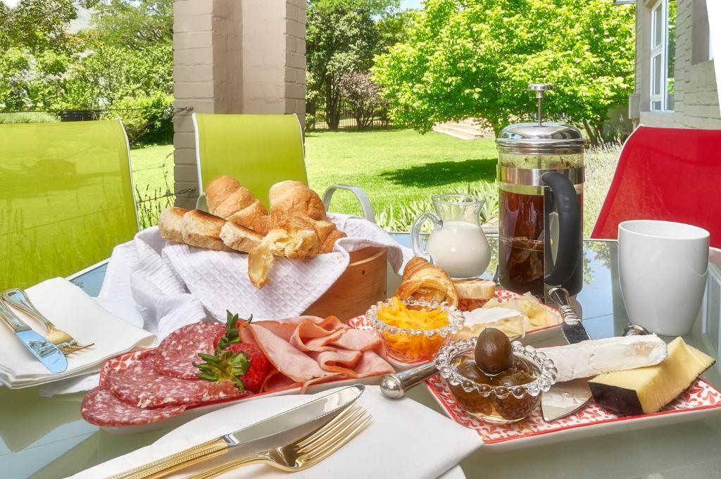 a table with a tray of food on it at Upper House Guesthouse in Clarens