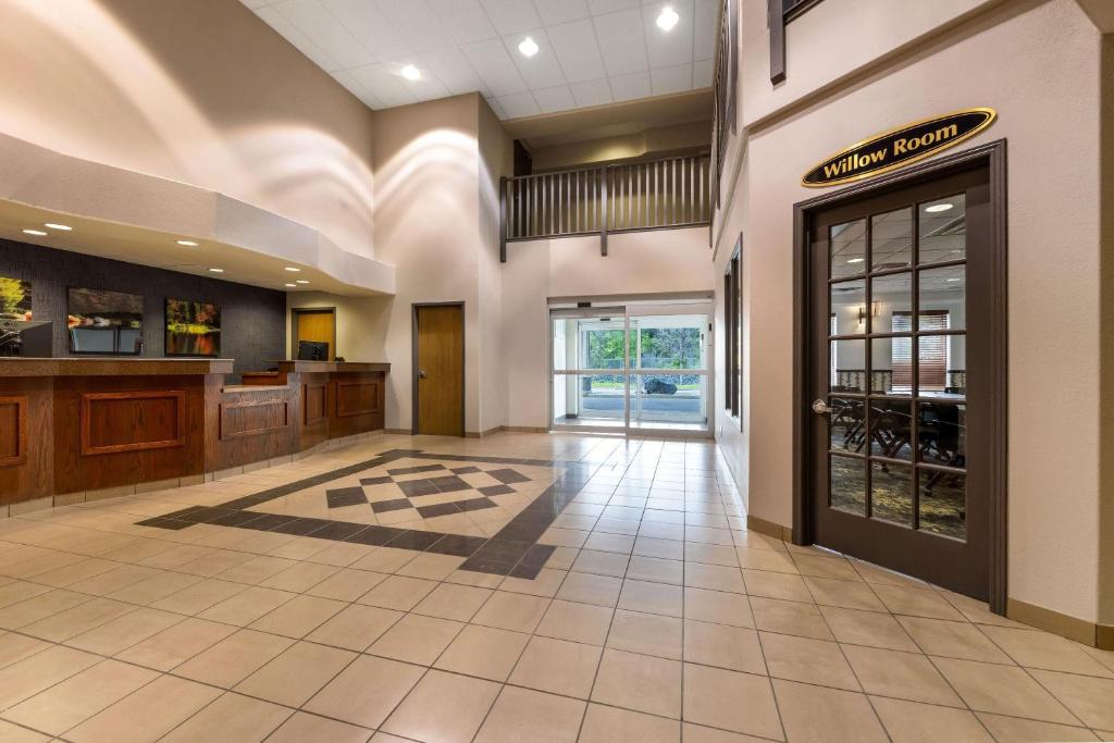 a lobby of a hotel with a glass door at Days Inn by Wyndham Thunder Bay North in Thunder Bay