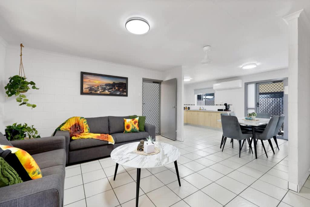 a living room with a couch and a table at Quiet & Comfortable with Wi-fi in Andergrove