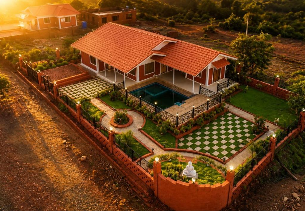 an aerial view of a house with a swimming pool at Snehdeep Villa, Konkan Trail in Dapoli