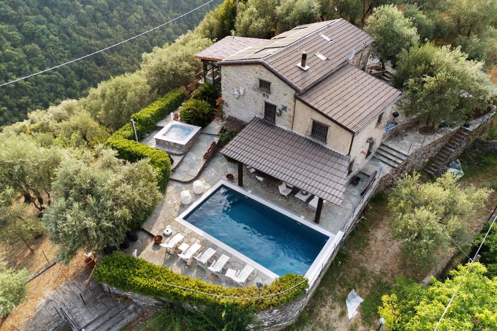 an aerial view of a house with a swimming pool at Villa Daphne Pool And Jacuzzi in Vescina