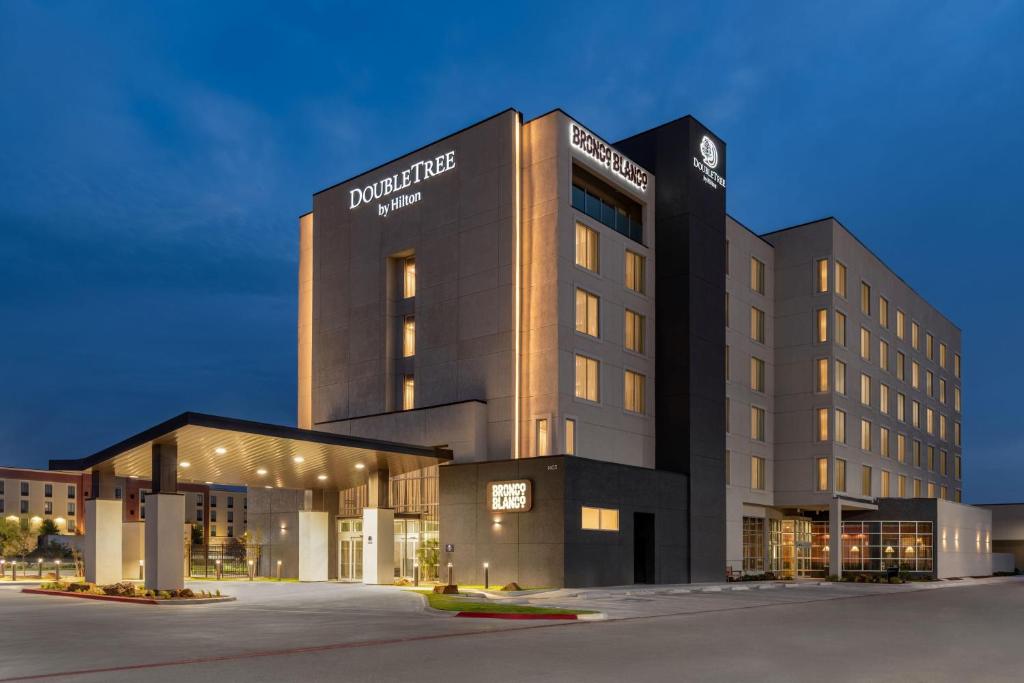 a building with a clock on the top of it at Doubletree By Hilton Midland West Loop I-250 in Midland