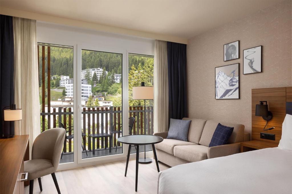 Travel Proud Sustainability certification Hilton Garden Inn Davos - Camera Familiare Queen Con Divano Letto