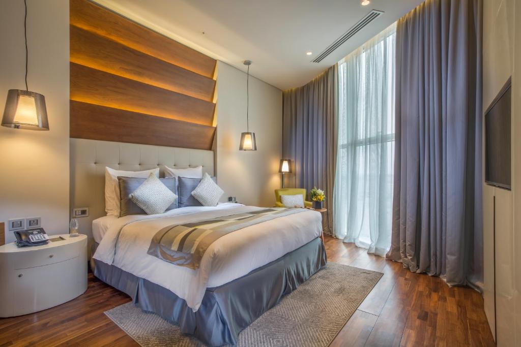Postel nebo postele na pokoji v ubytování The Avenue Hotel