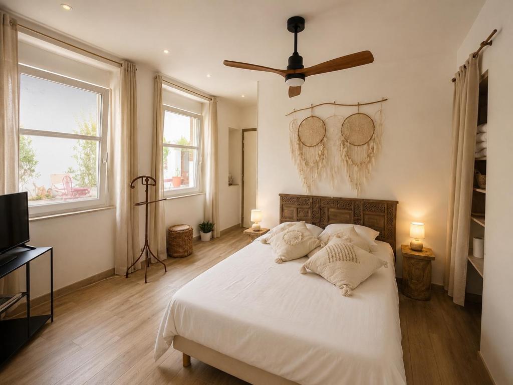 a bedroom with a bed with two pillows on it at Chambre Centre Ville Le Blanc in Le Blanc