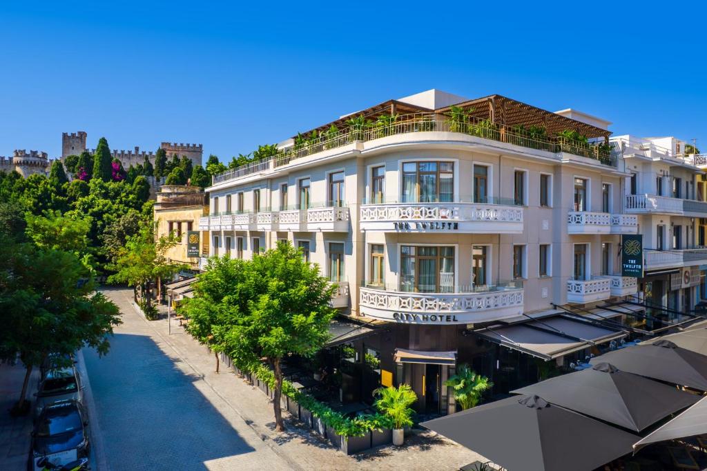 an overhead view of a building with an outdoor restaurant at The 12th City Hotel in Rhodes Town
