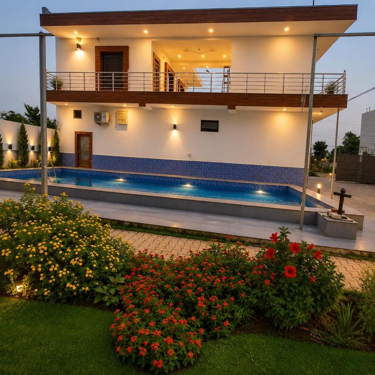 a house with a swimming pool in the yard at The Crown Resort in Sonīpat