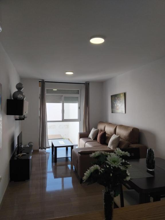a living room with a couch and a table at EDIFICIO SANTA GEMA 2k in La Cala de Mijas