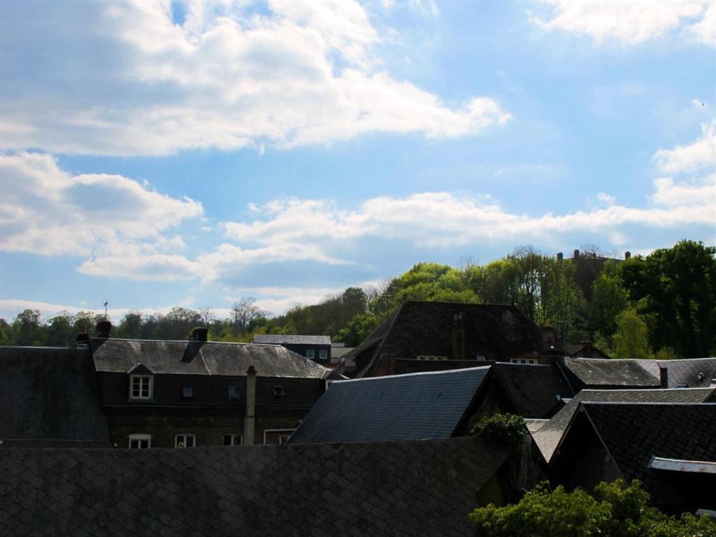 a view of a city with roofs and trees at L'Escale de Broglie in Broglie