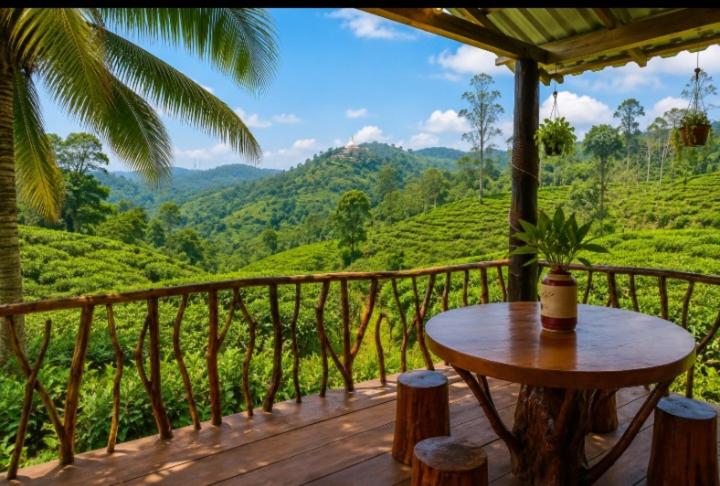 a wooden balcony with a table and a view of a tea plantations at Nine arch eco Villa Ella in Ella