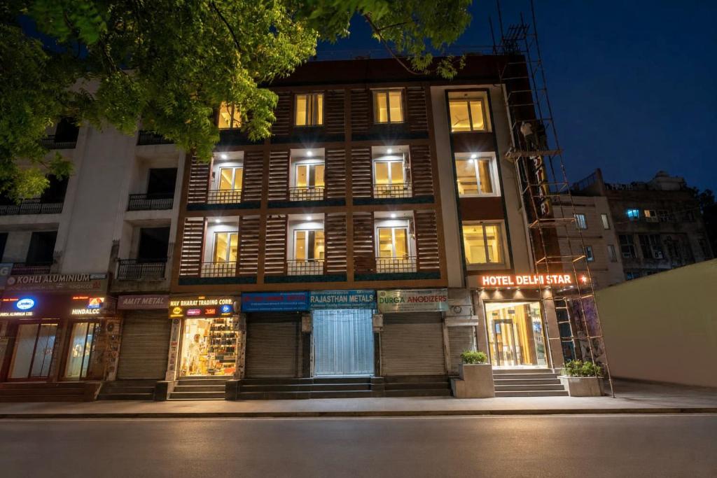 a building with lights on in a city at night at The Delhi Star Hotel near Connaught Place- New Delhi in New Delhi