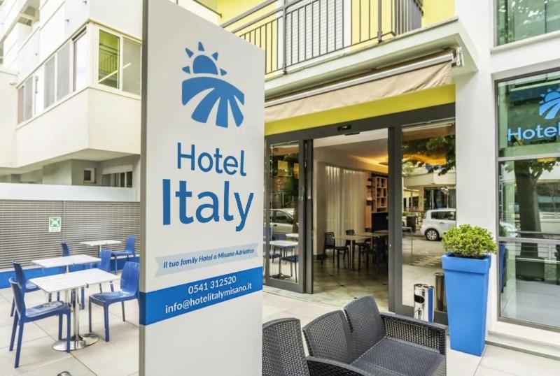 a hotel italy sign in front of a building at Hotel ITALY in Misano Adriatico