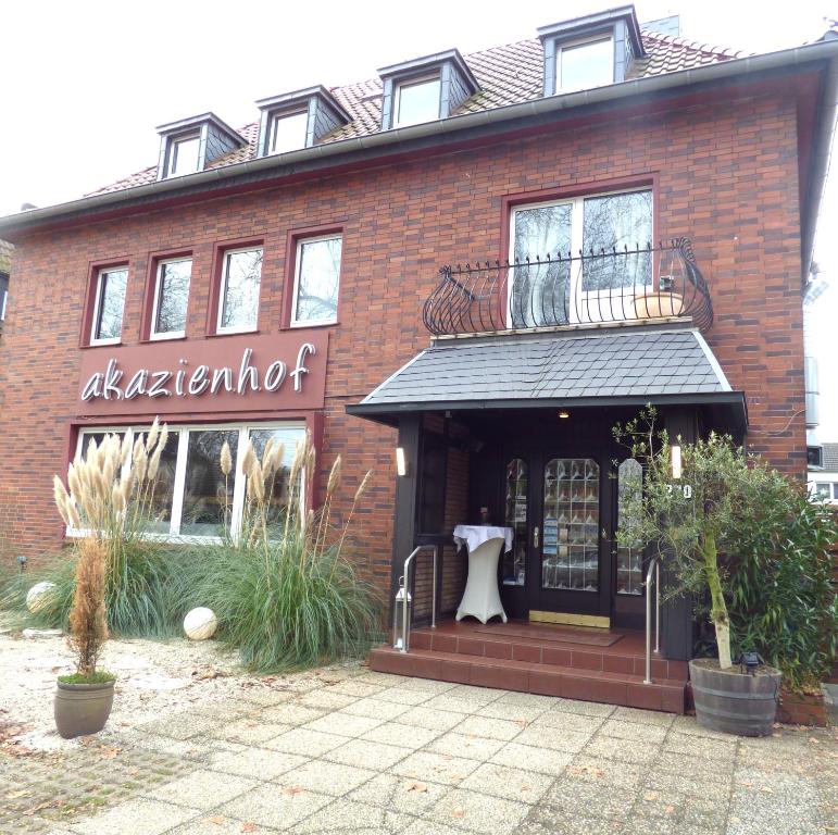 a store front of a brick building at Hotel Akazienhof in Duisburg