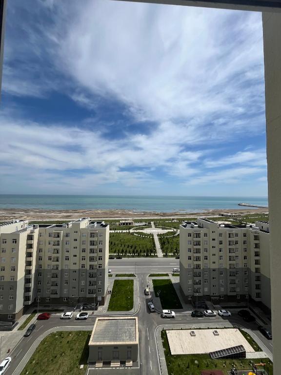 an aerial view of a parking lot with tall buildings at Sumgait Boulevard View Apartment in Sumqayıt