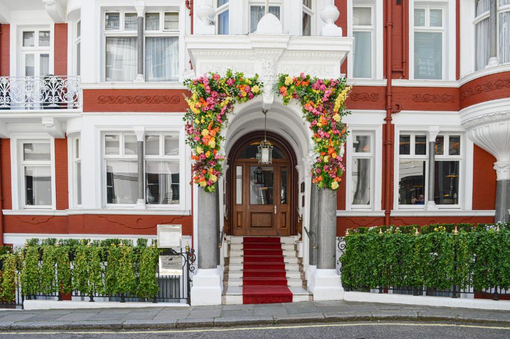 a building with a door with flowers on it at Althoff St James's Hotel & Club London in London