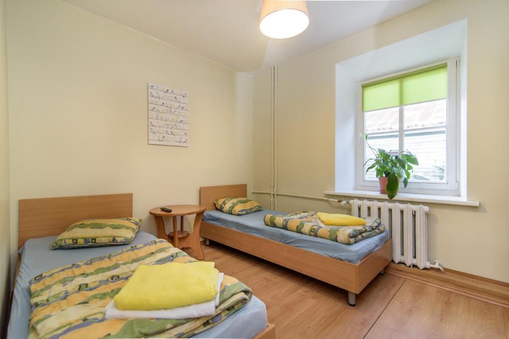 Postel nebo postele na pokoji v ubytování Hostel Filaretai