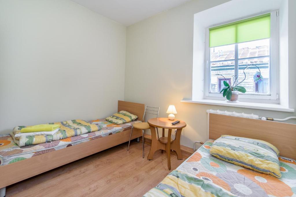 Postel nebo postele na pokoji v ubytování Hostel Filaretai