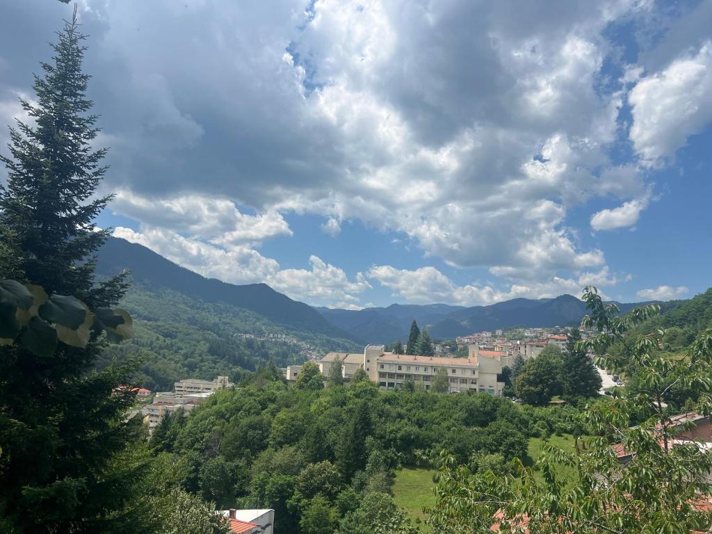 a view of a city with mountains in the background at Panorama Guest House in Smolyan