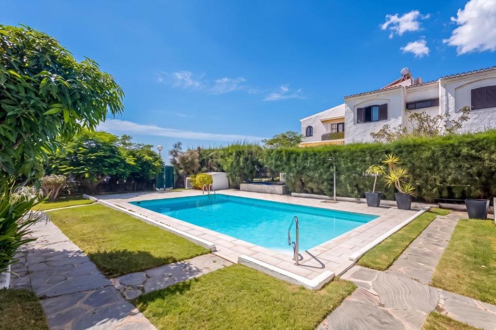 a swimming pool in the backyard of a house at GuestReady - Tarantos Sea View and Pool in Playa del Ingles