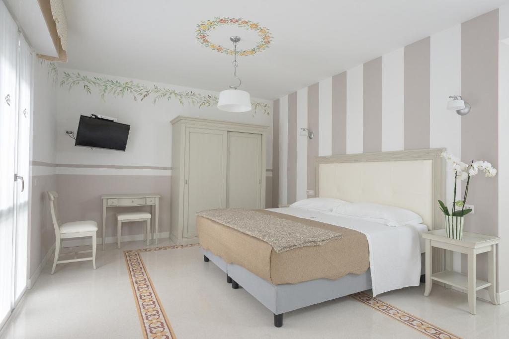 Posteľ alebo postele v izbe v ubytovaní Gruppo Luxe Domus Vigevano