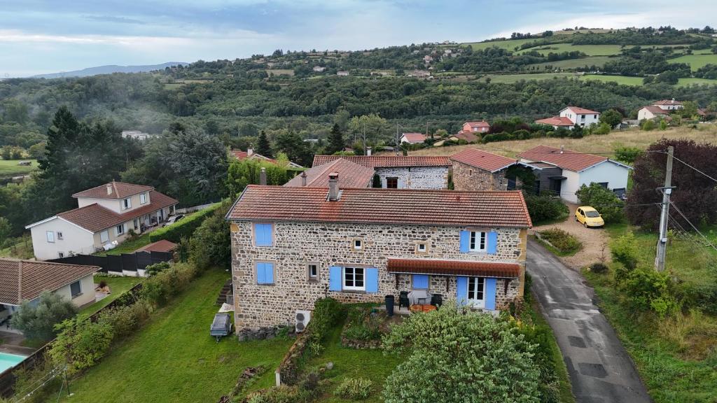 an aerial view of a stone house on a hill at Chez steph studio in Saint-Germain-Nuelles