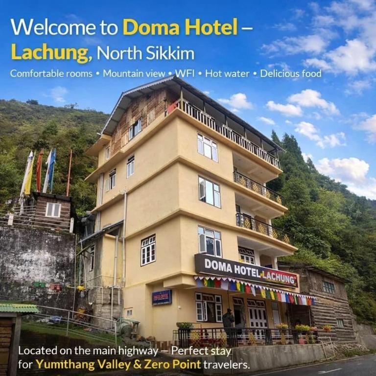 a building with a sign on the side of it at Doma Hotel lachung in Lachung