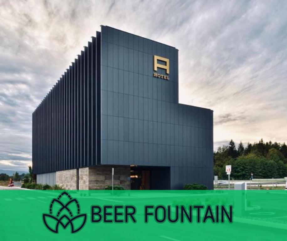 a building with a beer festival sign in front of it at Hotel A plus in Celje