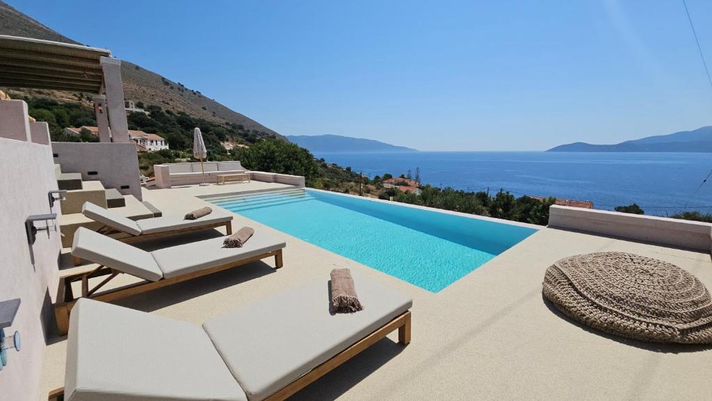 a villa with a view of the ocean at Doto Villa with private pool in Agia Effimia