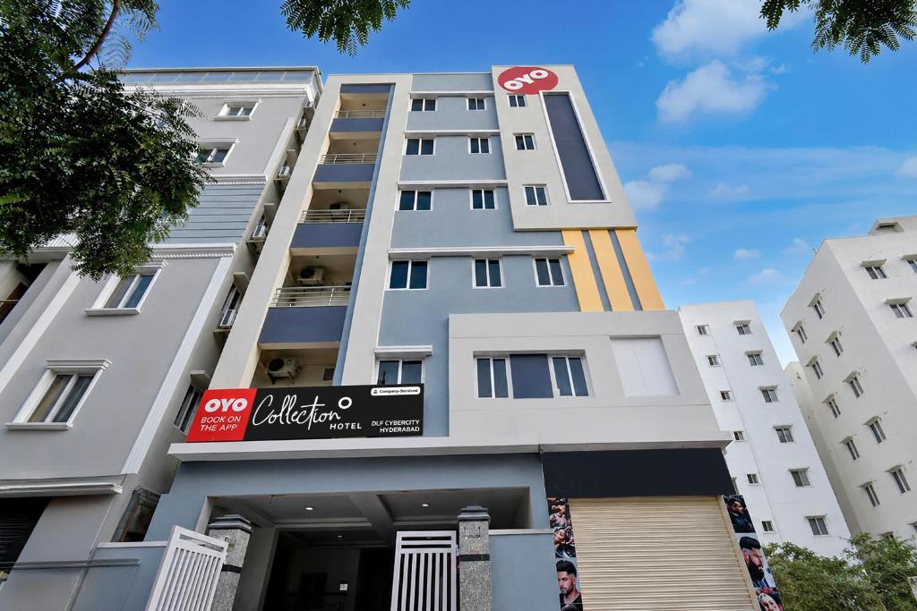 a building with a sign on the front of it at Super Collection O DLF CyberCity Hyderabad Formerly Key Suites in Kondapur