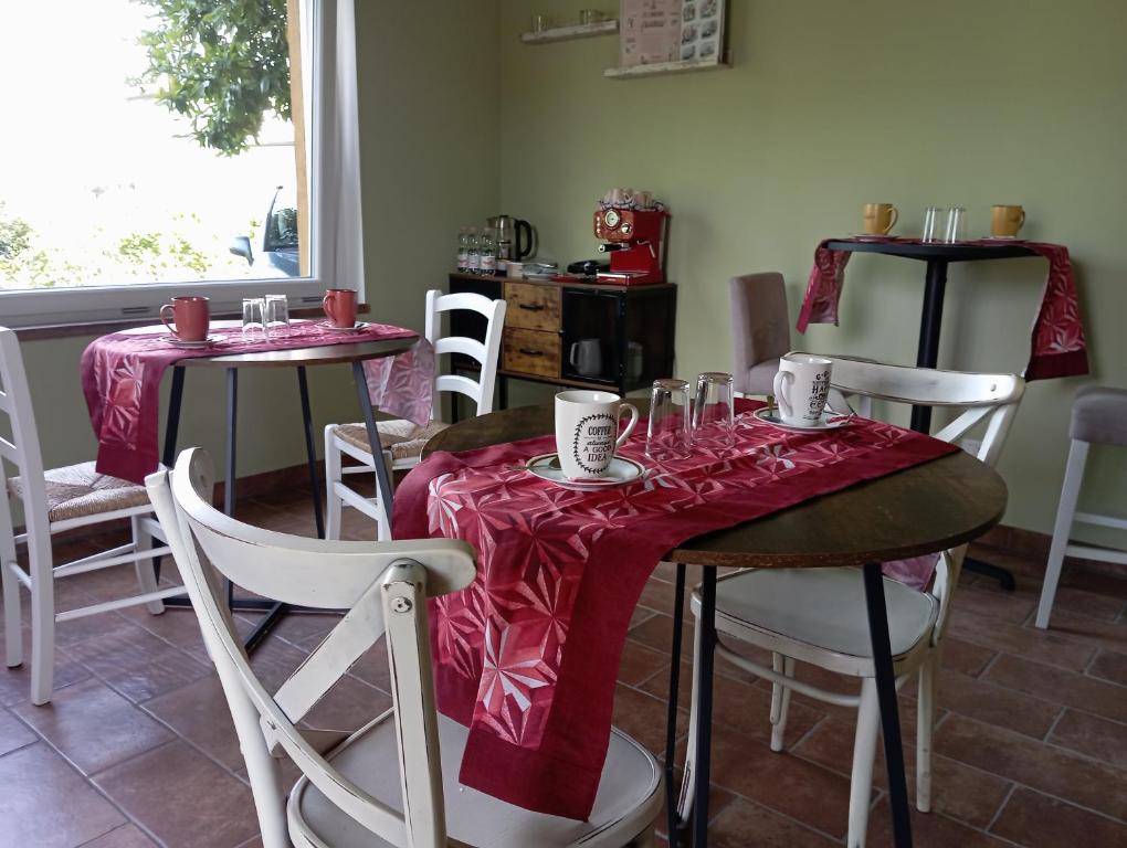 a dining room with two tables with wine glasses on them at Il Rifugio in Franciacorta in Erbusco