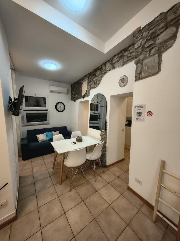 a living room with a table and a couch at Manarola Sunset House in Manarola