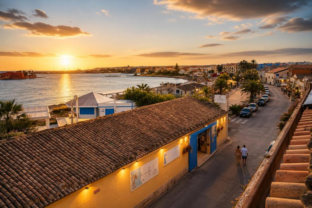 a view of a city with a river and buildings at Calauriia Apartments Marzamemi in Marzamemi