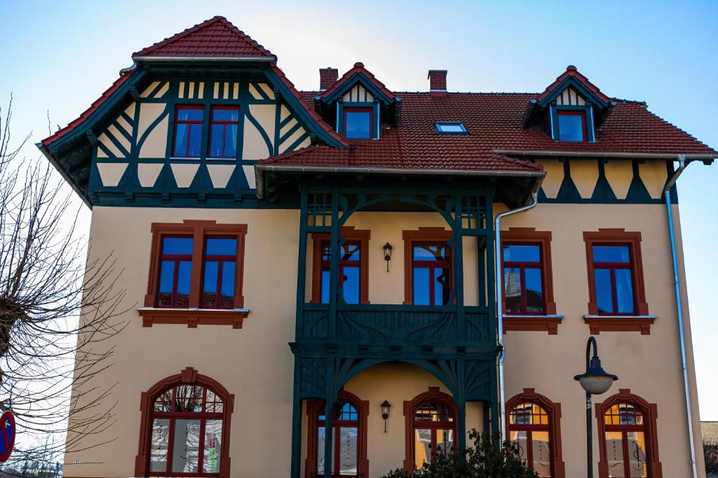a large house with a gambrel roof at Villa Weißbach - Haus Hilda in Flöha