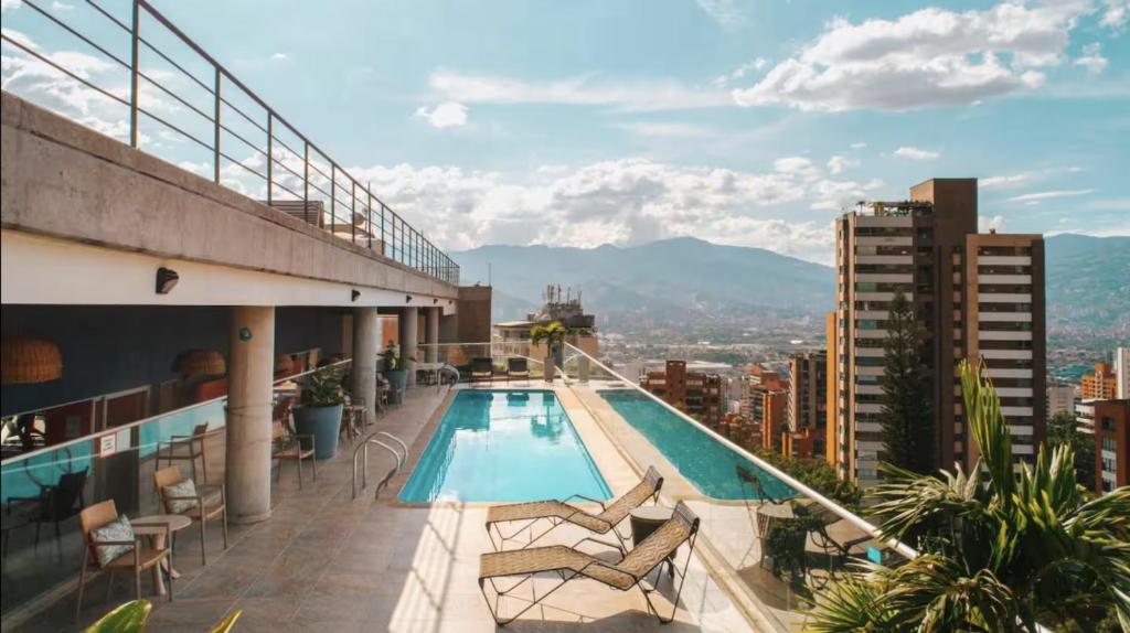 a swimming pool on the roof of a building at Luxury Studio El Poblado Pool Rooftop 4th Floor in Medellín