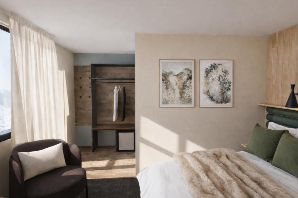 a bedroom with a bed and a chair at Tunet in Hemavan