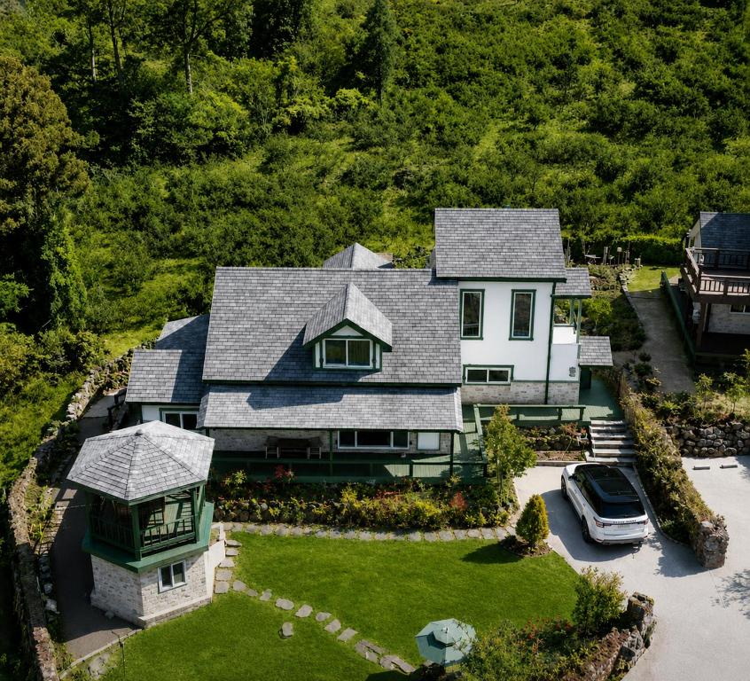 an aerial view of a house with a boat at Executive Home in Jeju in Jeju